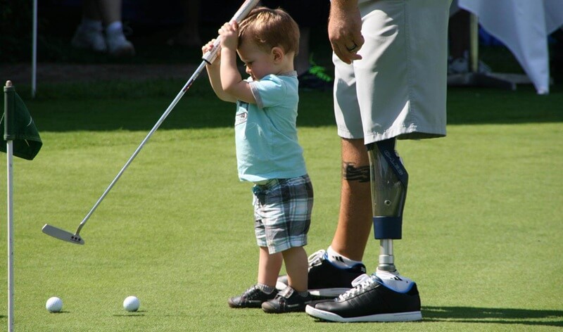 Military children playing golf
