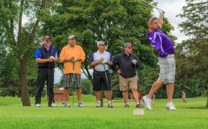 Wounded veteran Derek Goodridge golfing at a Tee It Up for the Troops event.