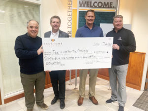 (Left to Right) Sam Stern, TruStone Financial Foundation Chairman and Steve Steen, Chief Business Officer of TruStone Financial, presented the $6,177 donation check to Patrick Nelson, U.S. Veteran and Tim Wegscheid, President and Executive Director of Tee It Up for the Troops.