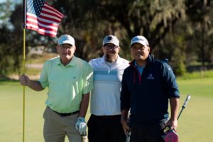 Mark Little, left, golfing with some of his military brothers at REUNION 2022.
